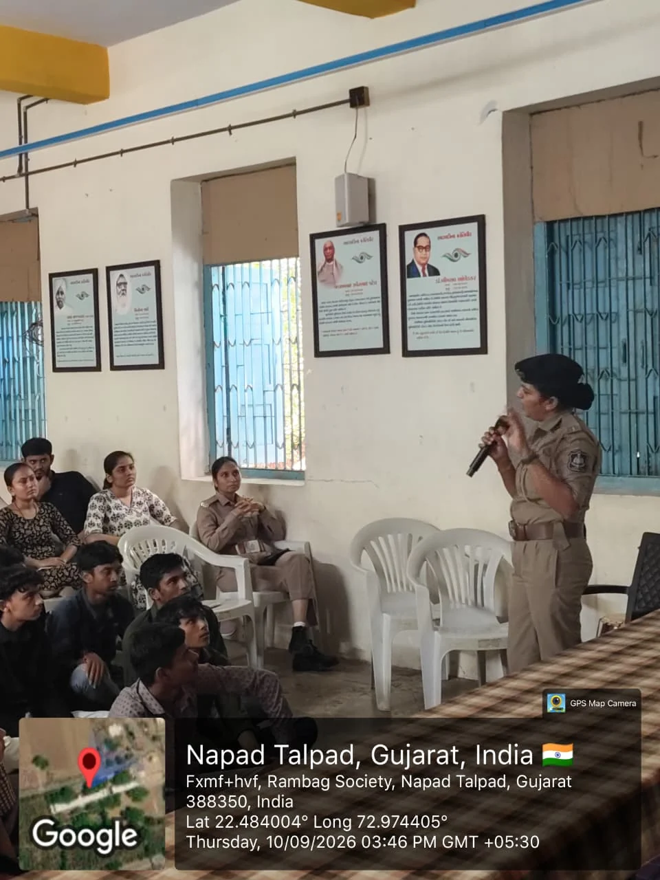 A police officer speaking with students at a school awareness session